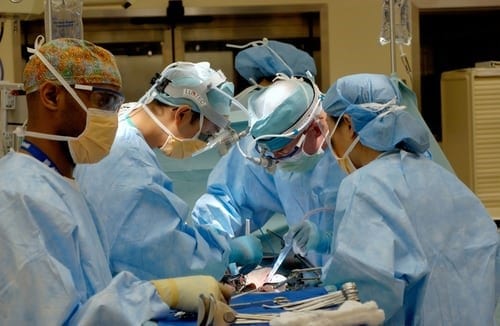 Doctors operating a patient