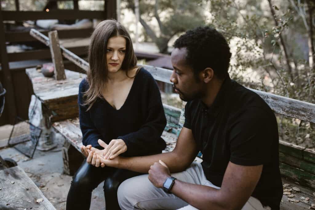 man sitting with a woman