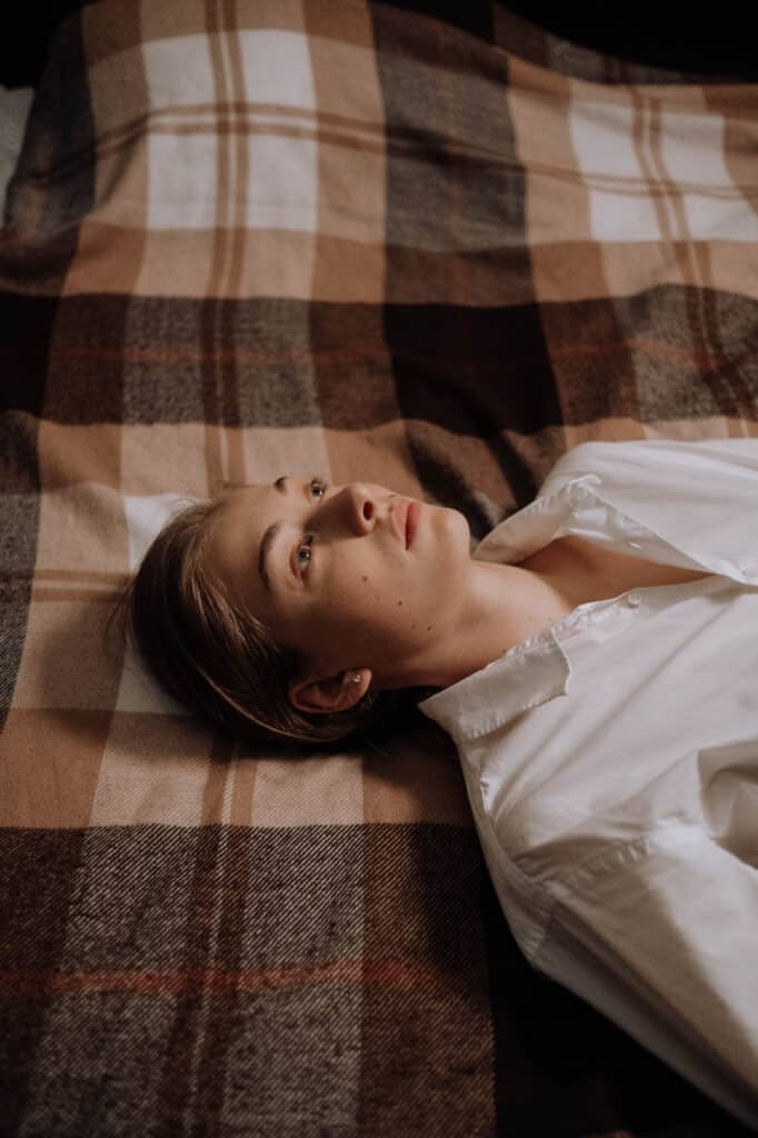 a woman lying on the bed
