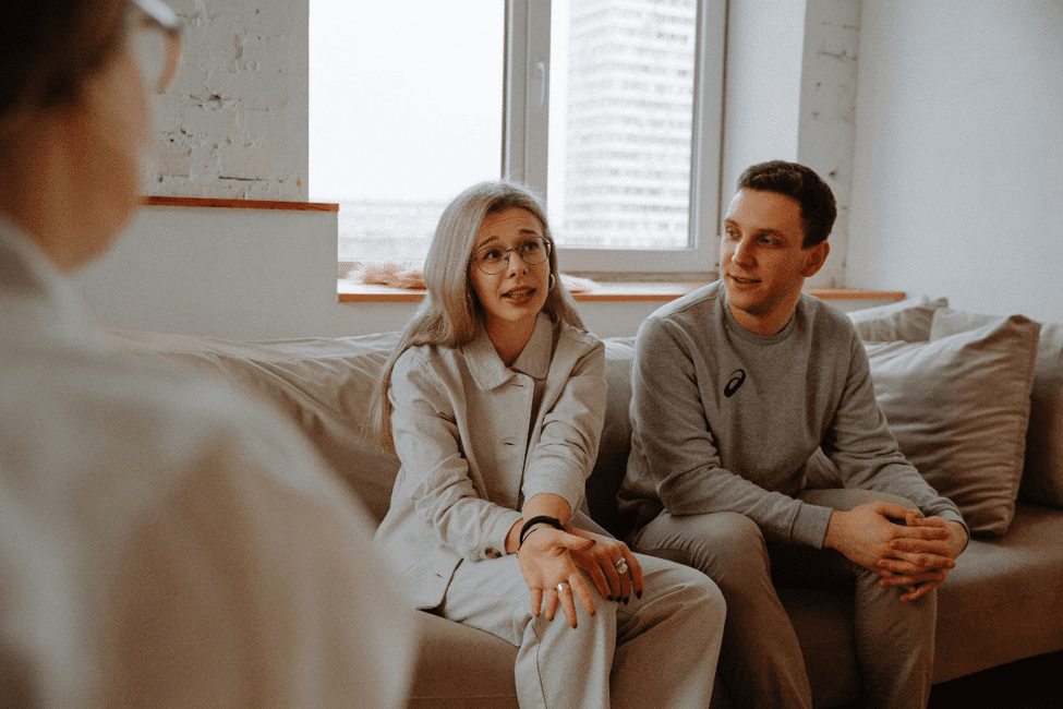 couple speaking with a therapist